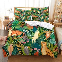 a bed with jungle animals and plants on it