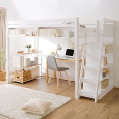 a white loft bed sitting next to a desk