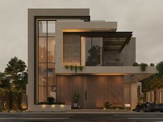 a large modern house with lots of windows and plants on the front door, along with cars parked outside