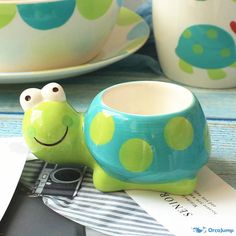 a close up of a cup and saucer on a table