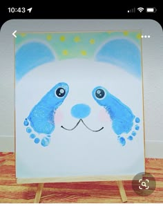 a painting of a blue and white panda bear with stars on it's head