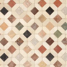 a tile floor with different colors and shapes