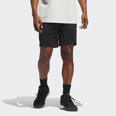 Cut to a mid-rise, these men's adidas basketball shorts are made from a breathable, soft, recycled fabric that goes beyond sport. They have an elastic-drawstring waist, side pockets, and three stripes. Wear them with a hoodie and sneakers for a casual look.Front Style: Flat FrontClosure Type: Drawstring, Full ElasticFit: Regular FitPockets: 2 Side Slip PocketsRise: Mid RiseShort Length: Mid LengthFiber Content: 100% Recycled PolyesterFabric Description: WovenInseam: 9 InCare: Machine Wash, Tumbl Casual Adidas Breathable Bottoms, Casual Breathable Adidas Bottoms, Adidas Relaxed Fit Sports Shorts, Adidas Logo Shorts For Streetwear, Adidas Logo Streetwear Shorts, Adidas Athletic Shorts With Logo For Streetwear, Adidas Athletic Shorts For Streetwear, Black Sportswear Bottoms For Basketball, Adidas Casual Athletic Shorts With Go-dry Technology