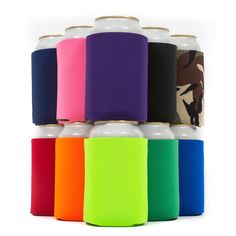 six different colored canisters are stacked on top of each other in front of a white background