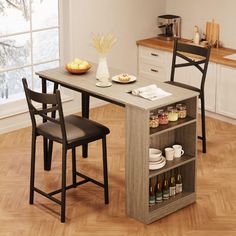 a kitchen table with two chairs next to it and an open shelf on the side