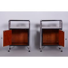 pair of chrome and wood nightstands with sliding doors