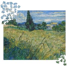 a puzzle piece with a painting of a field and trees in the background, surrounded by grass