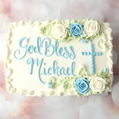 a cake with blue frosting and roses on it that says, godbles may be michael