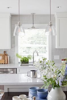 the kitchen is clean and ready to be used for cooking or baking, with blue dishes on the counter