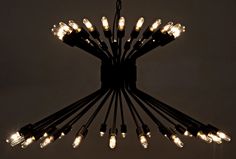 a chandelier with many lights hanging from it