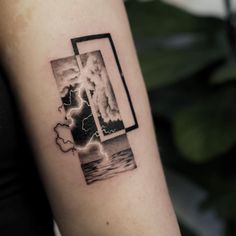 a woman's arm with a black and white photo on it