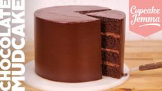 the chocolate cake is cut in half and ready to be eaten