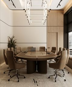 a round conference table surrounded by brown chairs