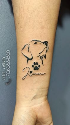 a dog's paw is shown on the wrist with its name written in black ink