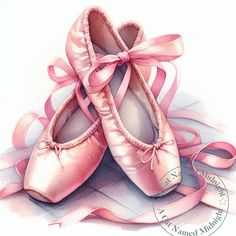 a pair of pink ballet shoes sitting on top of a pile of ribbons