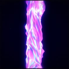 an abstract photograph of the shape of a tall column in pink and blue light with black background