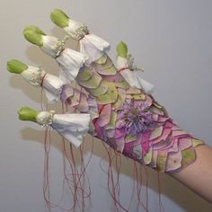 a woman's hand with flowers on it