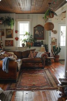 a living room filled with furniture and lots of plants