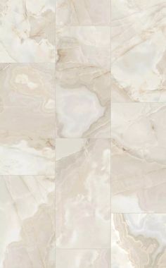 an image of marble tiles with white and beige colors on the floor, as seen from above