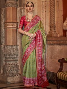 This stunning saree features a beautiful green color with intricate zari patola print work that exudes elegance and grace. The red color silk material blouse with patola print work perfectly complements the saree, adding a touch of sophistication to your overall look.
The saree and unstitched blouse material comes in a generous 5.50 meters length, giving you the flexibility to style it in various ways to suit your personal taste and body type. Whether you're attending festivals, weddings, or any Green Semi-stitched Saree, Navratri Pista Green Traditional Wear With Traditional Drape, Pista Green Traditional Wear For Navratri, Green Cutdana Traditional Wear For Eid, Unstitched Green Saree For Navratri, Green Cutdana Traditional Wear For Festive Season, Festive Green Cutdana Traditional Wear, Green Dola Silk Saree For Puja, Green Anarkali Traditional Wear For Navratri