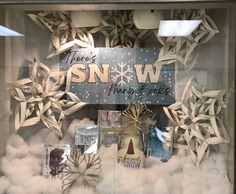 there is a display window with snow decorations