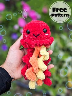 a hand holding a red stuffed animal with bubbles around it and the caption free pattern