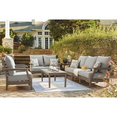 an outdoor patio furniture set with cushions