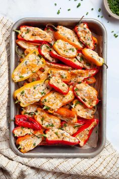 chicken stuffed peppers in a baking pan