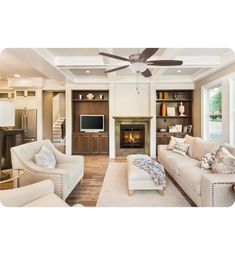 a living room filled with furniture and a fire place in the middle of it's walls