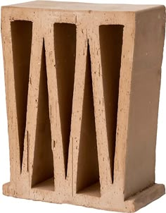 a cement block with three sections cut out