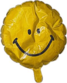 a yellow plastic bag with a smiley face on it