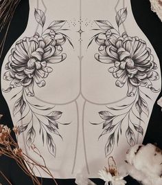 the back of a woman's torso with flowers on it and cotton floss