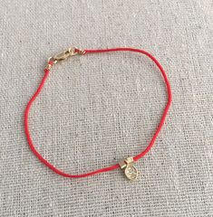 Silk/nylon string with gold filled leaf charm bracelet Minimalist Red Bracelets With Adjustable Cord, Red Adjustable Minimalist Braided Bracelets, Red Adjustable Braided Bracelet, Red String Of Fate Bracelet, Adjustable Red Nylon Cord Braided Bracelet, Horseshoe Earrings, Everyday Earrings Studs, Good Luck Necklace, Red String