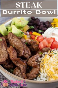 steak burrito bowl with black beans, tomatoes, avocado and sour cream