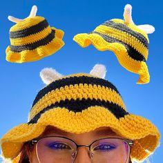 a woman wearing glasses and a knit bee hat