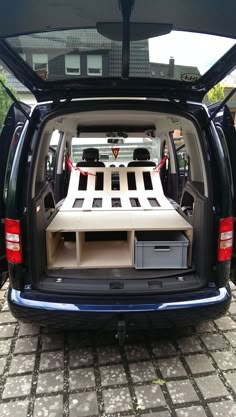 the back end of a van with its trunk open