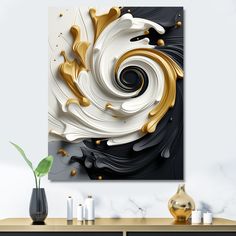 an abstract painting with gold and white swirls on a wall above a console table