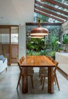 a wooden table sitting in the middle of a room