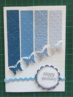 a birthday card with blue and white paper