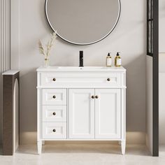 a bathroom vanity with a round mirror above it