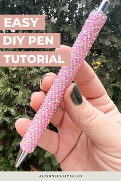 a person holding a pink pen in their hand with the words easy diy pen