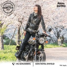 a woman sitting on top of a motorcycle next to trees and grass with the caption royal enfield