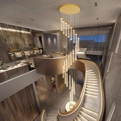 a spiral staircase with chandelier hanging from it's sides in a modern home