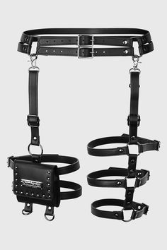 CARRION.- Statement faux leather harness.- Popper closure bag.- Detachable, adjustable leg straps.- Gun-metal hardware.- Closure measurements:   XS-M waist 67cm-74cm, thigh 50cm-60cm.   L-XXL waist 88cm-100cm, thigh 50cm-60cm.  3XL-4XL waist 113cm-125cm, thigh 50cm-61cm.With KILLSTAR branding, 100% PU.Wipe clean. Imported. Leather Harness Outfit, Thigh Straps, Thigh Bag, Thigh Harness, Thigh Holster, Harness Fashion, Leg Harness, Leg Straps, Leg Bag