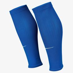 the legs of a soccer player wearing blue socks with white piping on their ankles