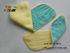 two oven mitts are sitting on top of each other, one is yellow and the other is blue