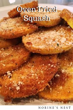 oven fried squash with parmesan cheese and seasoning on the side, served in a white bowl