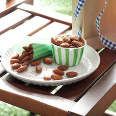 a plate with nuts on it next to a paper bag