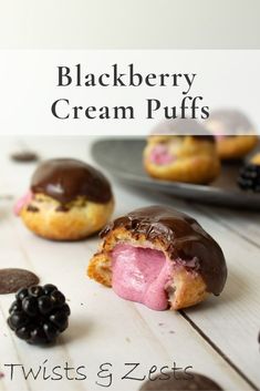 blackberry cream puffs with chocolate frosting and fresh berries