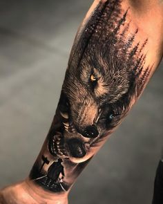 a man with a wolf tattoo on his arm